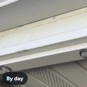 Bayline light mounted under a soffit during the day
